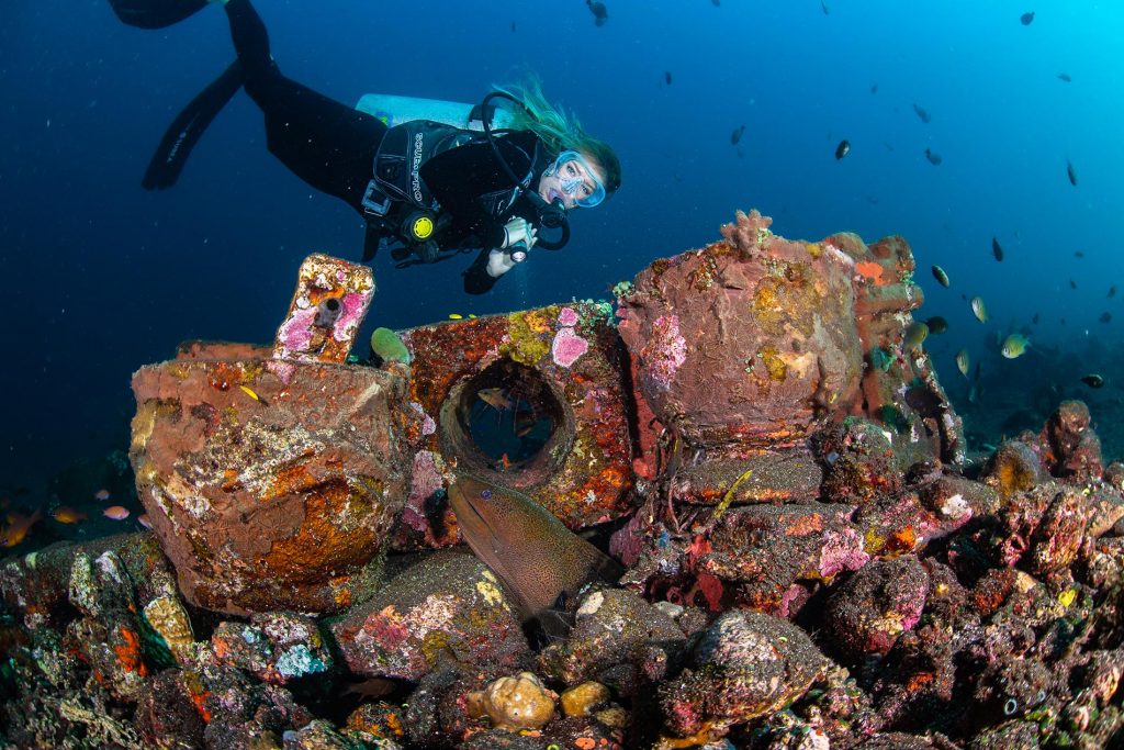 An underwater shot of a scuba diver at the USAT Liberty wreck site in Tulamben, East Bali